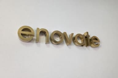Enovate logo sign on the office wall