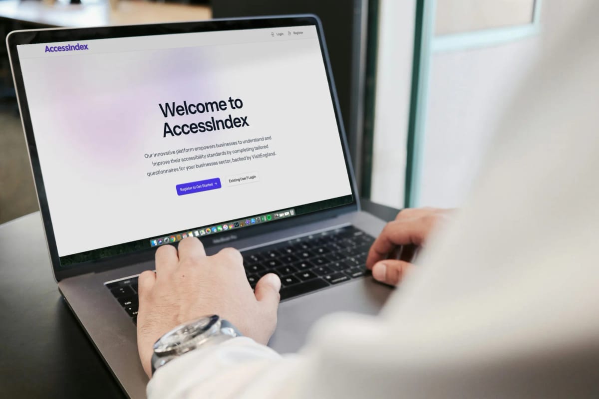 AccessIndex welcome screen shown on a laptop